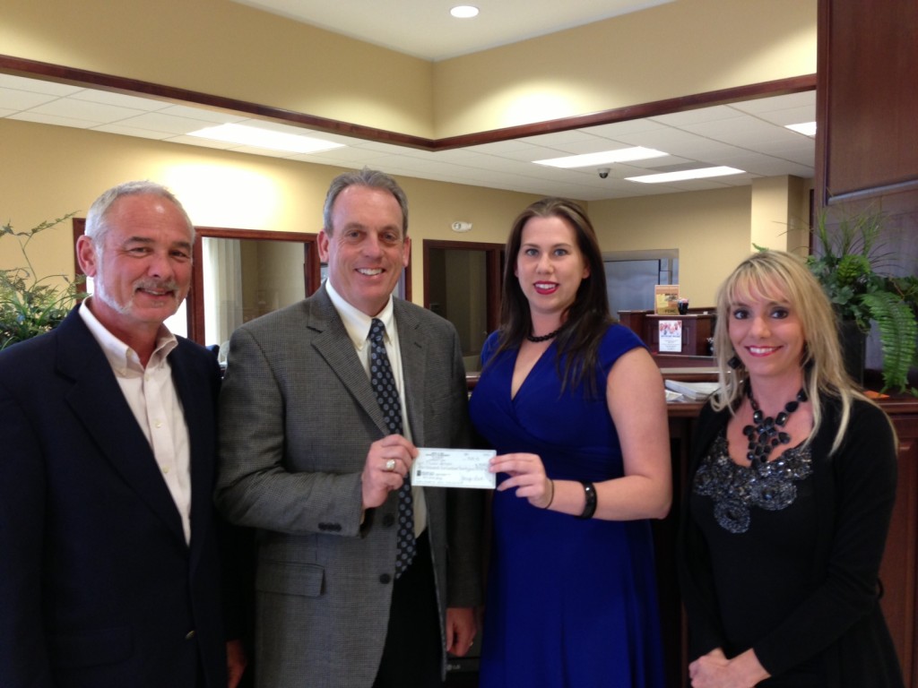 Pictured are Fowler-Bonan Foundation executive director Kerry Camp, (l-r) Foundation board chairman Dale Fowler, Lodge Exalted Ruler Jessica Mitchell and Monopoly committee chairman Genny Craig, all of Harrisburg. 