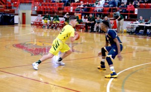 Senior PG Cody Schultz from Paducah Tighlman drives around a Webster defender.