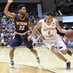 Saluki guard Jonathan Wiley drives around a UT Martin Defender (Byron Heltzer-Southern Illinoisan photo.)