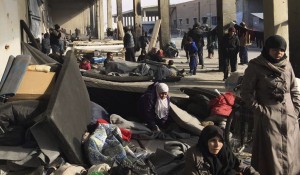 Photo by: Uncredited This image released by the International Committee for the Red Cross (ICRC) shows Syrians who were displaced with their families from eastern Aleppo gather at the collective shelter, in the village of Jibreen south of Aleppo, Syria, Monday, Dec. 12, 2016. Syria's military said Monday it has regained control of 98 percent of eastern Aleppo, as government forces close in the last remaining sliver of a rebel enclave packed with fighters as well as tens of thousands of civilians. (ICRC via AP)