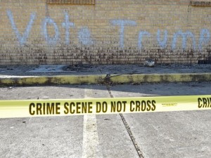 The spray-painted graffiti on the burned out shell of the Hopewell Baptist Church in Greenville MS. It became a rallying cry of some, claiming that all Trump supporters are racist. 