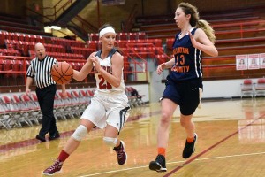 The FCHS Lady Redbirds Morgan Griffith has the look of determination as she drives to the basket against Gallatin Co.'s Hailey Chubb. Griffith scored a career high 46 points and Chubb scored 38 in West Frankfort's 92-87 overtime victory Tuesday. (westfrankfortsports.com photo)