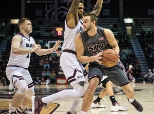 Sean O'Brien takes it to the hoop around two Missouri State Defenders (SIU Media Services)