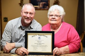 West Frankfort native and recently retired master seargent from the ISP, Scott Isaacs presenting his mother his degree from JALC