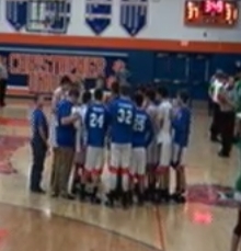 Christopher coach Eric Stallman giving his team instructions during a timeout in the third quarter. 