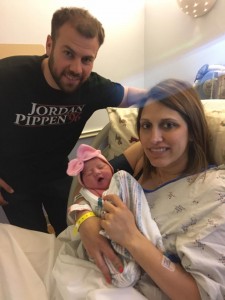 Bryce and Jodi Bainter with Hensley Jean.  