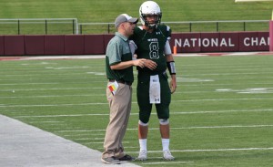 Coach Popovich with his QB Dennis Chester at a game against Robert Morris Peoria at Saluki Stadium earlier in the season.