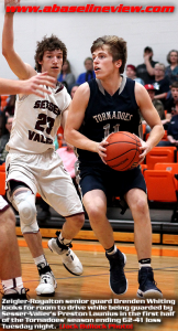 Z-R senior guard Brendan Whiting looks to drive around S-V defender Preston Launius in last night's game. (Jack Bullock, Photo)