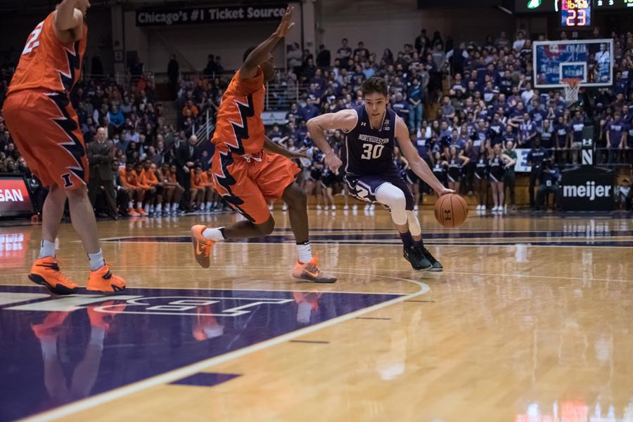 Northwestern guard Brant McIntosh drives around an Illini defender earlier in the season ( Sara Gronlek - Daily Northwestern  