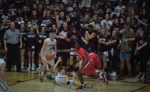 Derek Oxford dives for a loose ball after a missed layup and Timmy Henson goes for the ball as well.  In the background is the awesome BCHS student section. (Richard Sitler- Southern Illinoisan Photo)