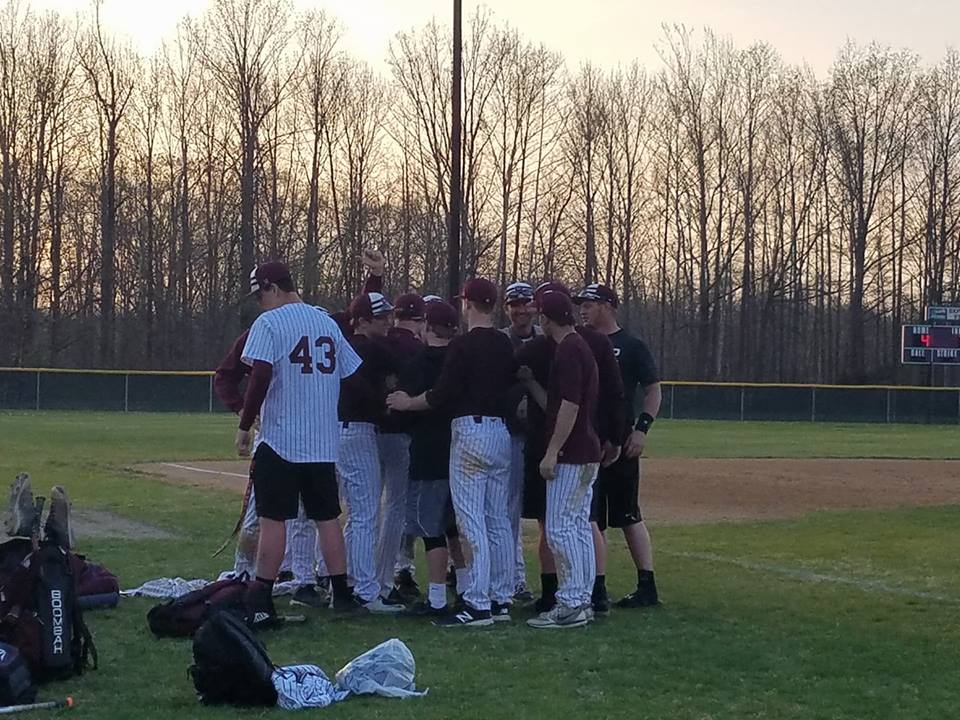 The Benton Rangers present baseball coach Brett Blondi the game ball after picking up his 200th win yesterday. 