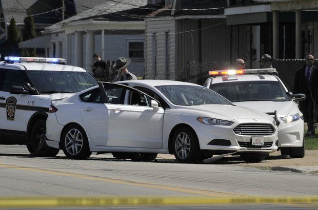 Pennsylvania State Police investigate a car and probable suicide of the Cleveland Facebook killing suspect in Erie, Pa. on April 18. The car was stopped near Buffalo Road and Downing Avenue. [GREG WOHLFORD/ERIE TIMES-NEWS] (Greg Wohlford)